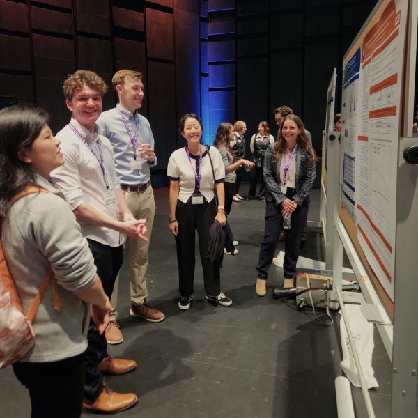 Julie-hahn smiling-at-poster-presentation.jpg